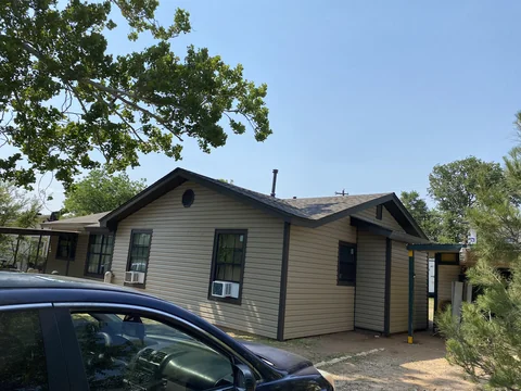 Angled view of the same completed vinyl siding installation.