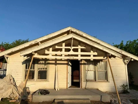 Front of the same home before the gray exterior and white trim were finished.