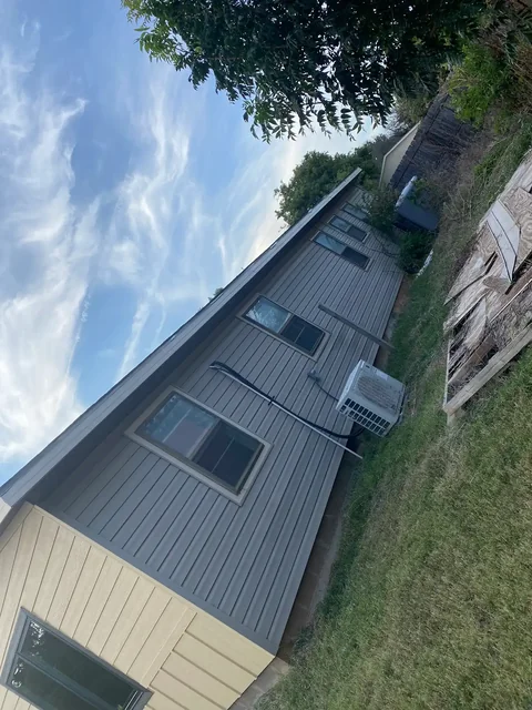 An angled view of the earlier exterior siding on Bruce’s home.
